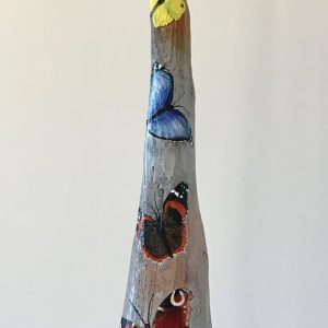 Driftwood with butterflies painted on